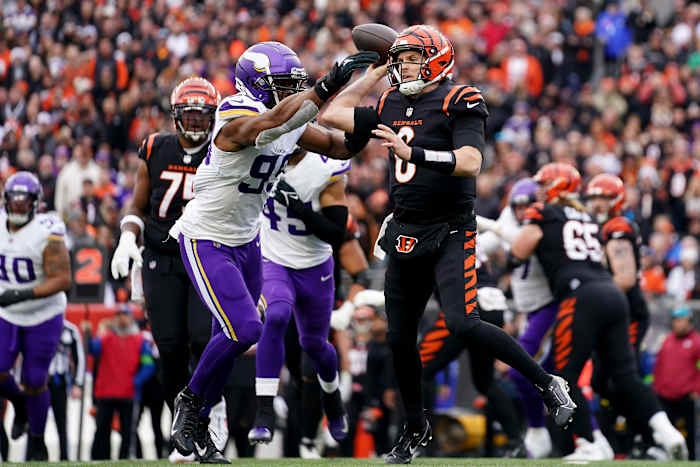 Cincinnati Bengals quarterback Jake Browning (6) throws under pressure from Minnesota Vikings linebacker Danielle Hunter (99) in the third quarter of a Week 15 NFL football game between the Minnesota Vikings and the Cincinnati Bengals, Saturday, Dec. 16, 2023, at Paycor Stadium in Cincinnati. The Cincinnati Bengals won 27-24 in overtime.